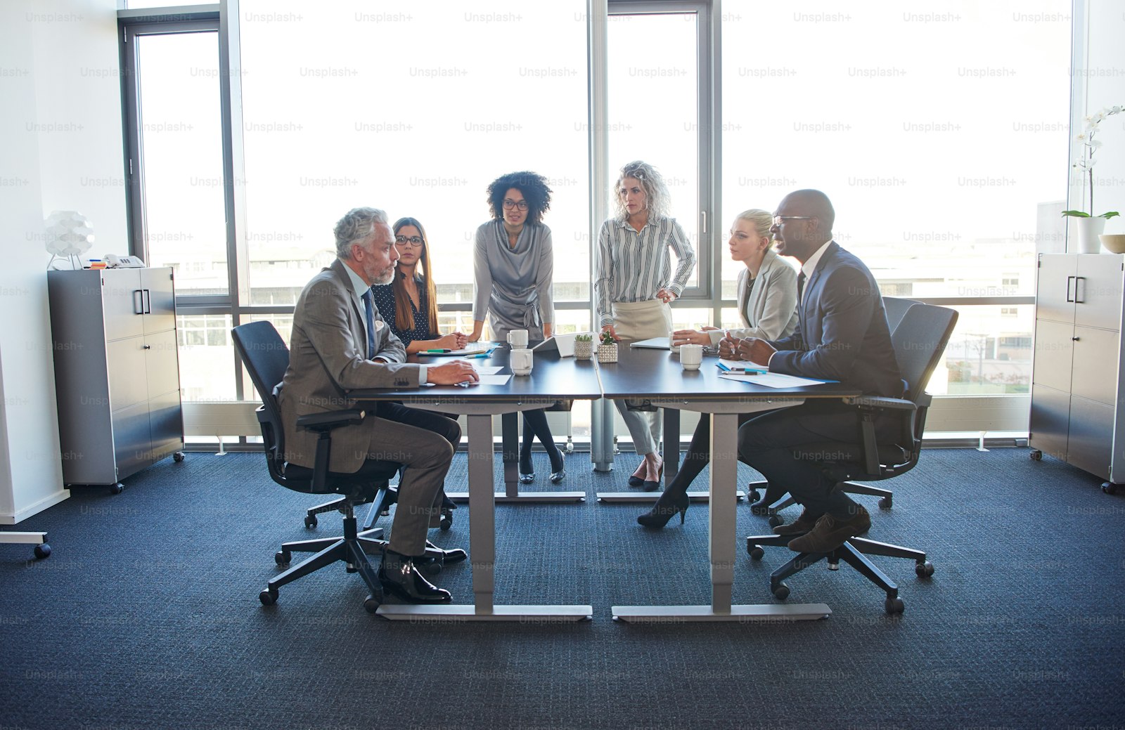 Group of people meeting around a conference table